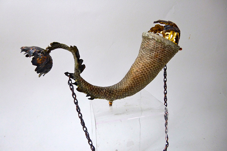 Salmon covered horn, copper and gold leaf